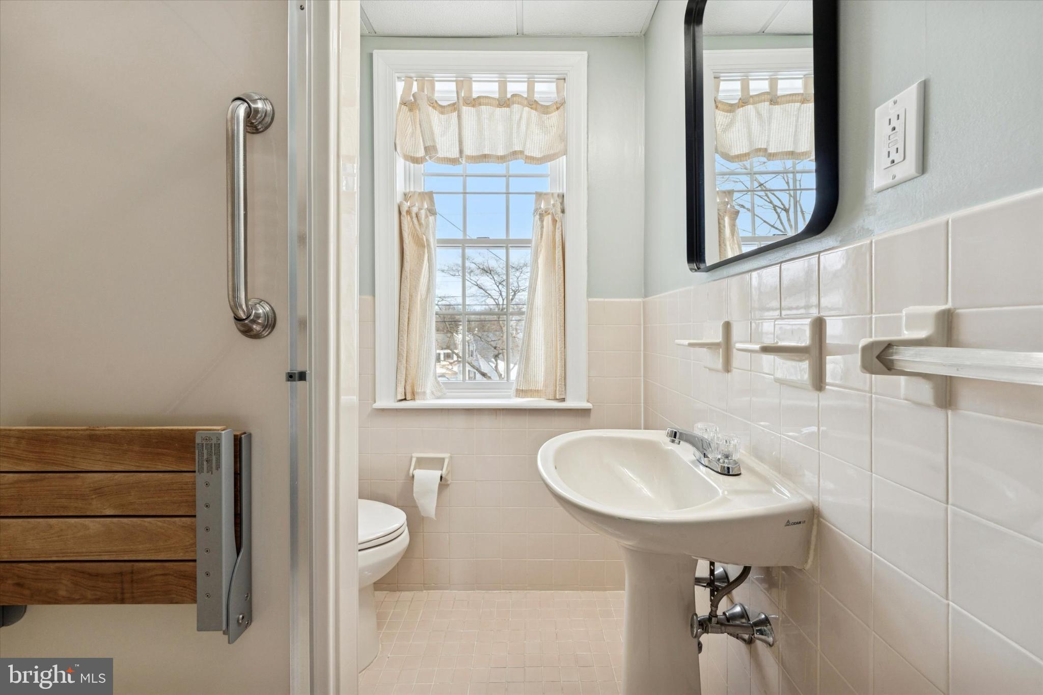 8711 Old Line Road Philadelphia, PA 19128 - Photo 14 of 21 a bathroom with a sink a toilet and shower