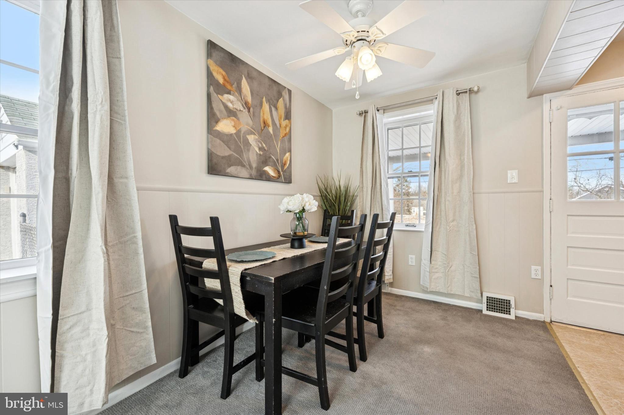 8711 Old Line Road Philadelphia, PA 19128 - Photo 5 of 21 a view of a dining room with furniture and chandelier