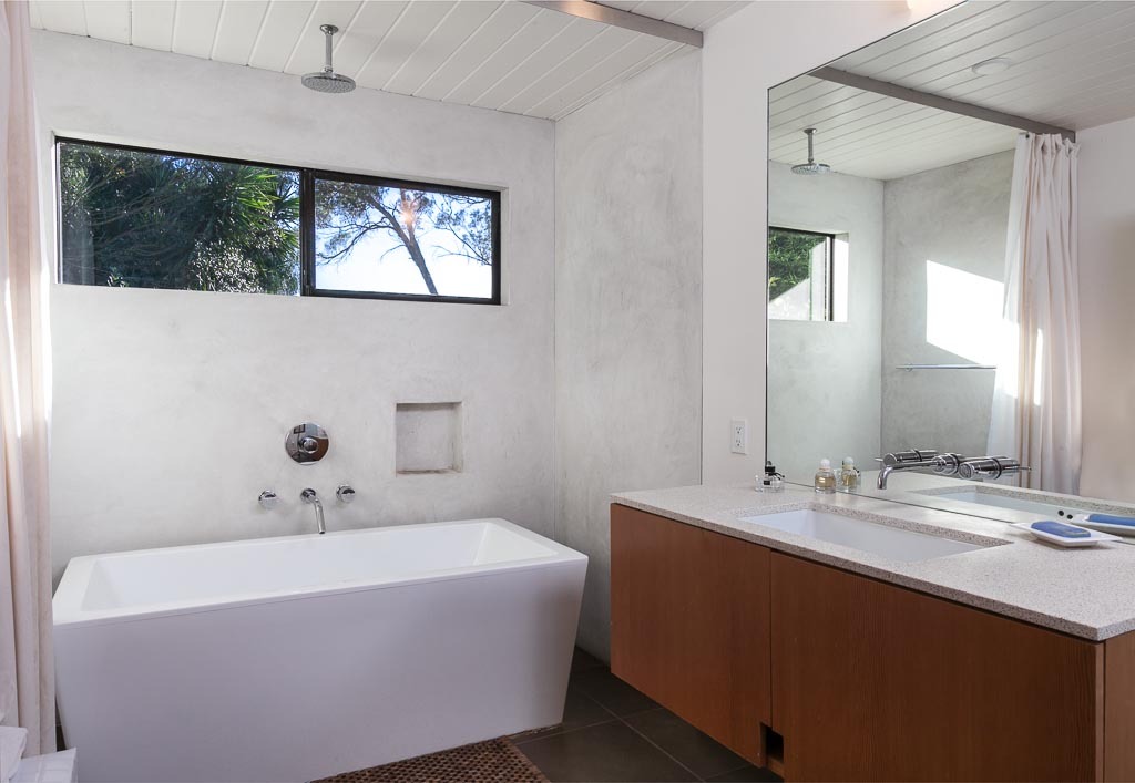 524 Barker Pass Road Montecito, CA 93108 - Photo 12 of 19 a bathroom with a tub sink and mirror