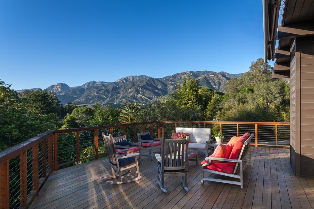 524 Barker Pass Road Montecito, CA 93108 - Photo 13 of 19 a balcony with wooden floor table and chairs