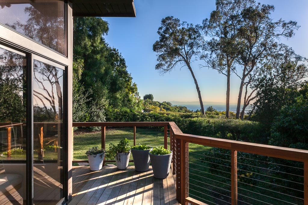 524 Barker Pass Road Montecito, CA 93108 - Photo 15 of 19 a view of a balcony with wooden floor and fence