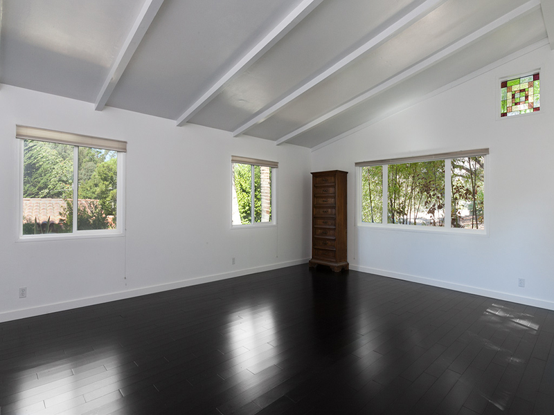 524 Barker Pass Road Montecito, CA 93108 - Photo 18 of 19 a view of an empty room with wooden floor and a window