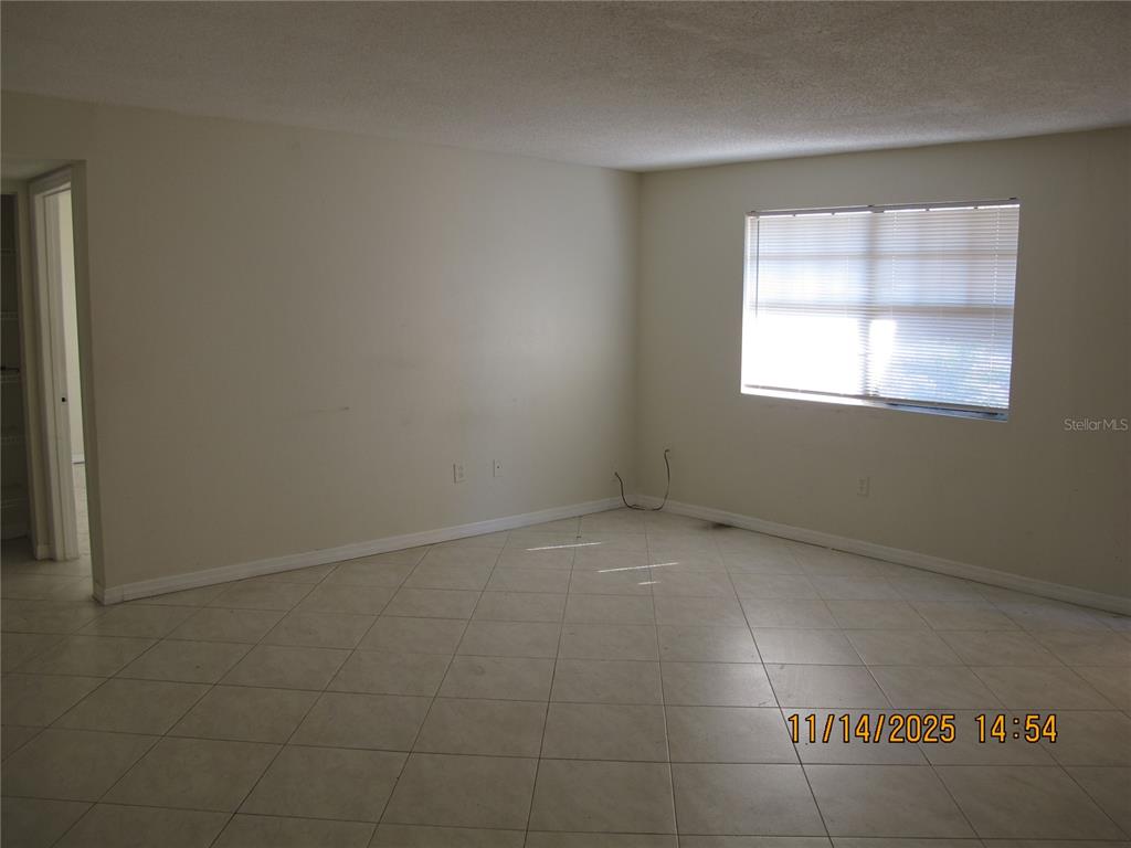 12405 Orange Blossom Oak Place, Unit 201 Tampa, FL 33612 - Photo 4 of 11 an empty room with a window