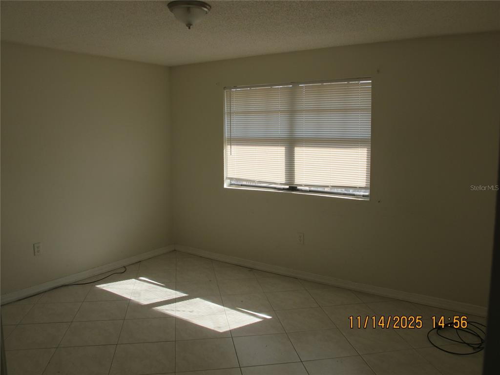 12405 Orange Blossom Oak Place, Unit 201 Tampa, FL 33612 - Photo 9 of 11 an empty room with a window