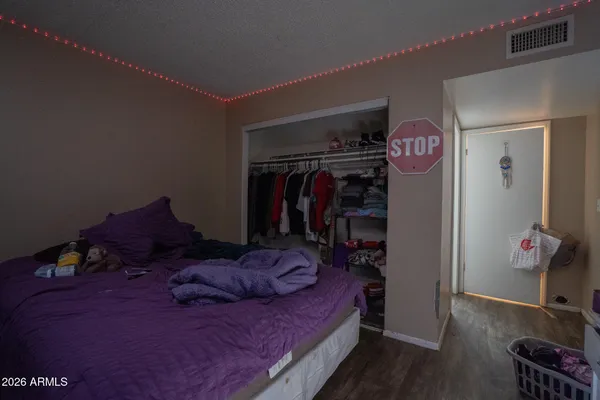 a bed room with a bed and a tv