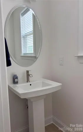 a bathroom with a sink a vanity and a mirror