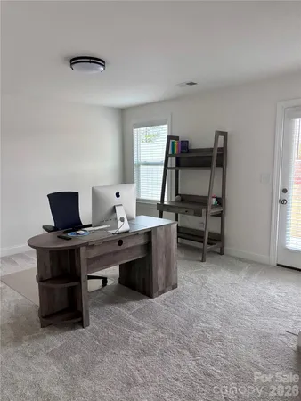 a view of a workspace with furniture