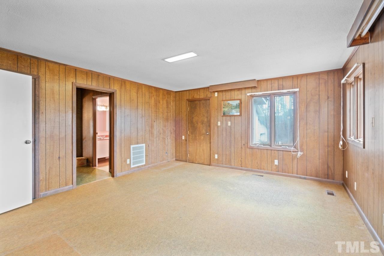 4762 Farrell Road Sanford, NC 27330 - Photo 15 of 18 a view of an empty room with closet and a window