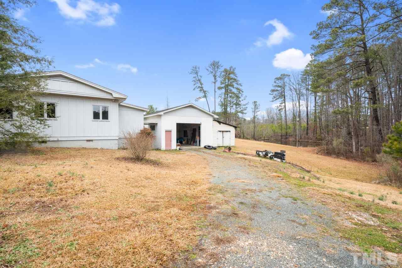 4762 Farrell Road Sanford, NC 27330 - Photo 4 of 18 a backyard of a house