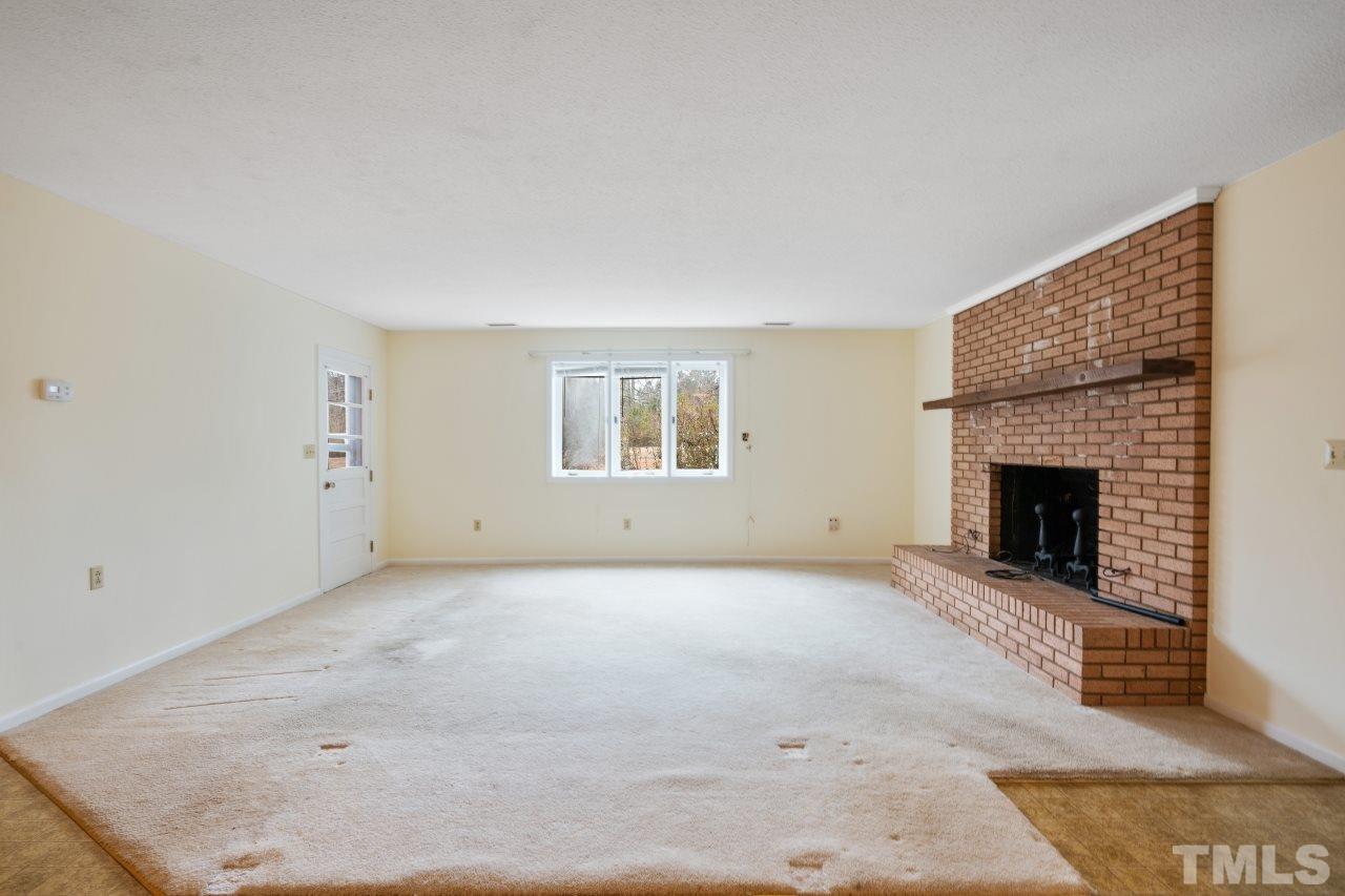 4762 Farrell Road Sanford, NC 27330 - Photo 5 of 18 an empty room with windows