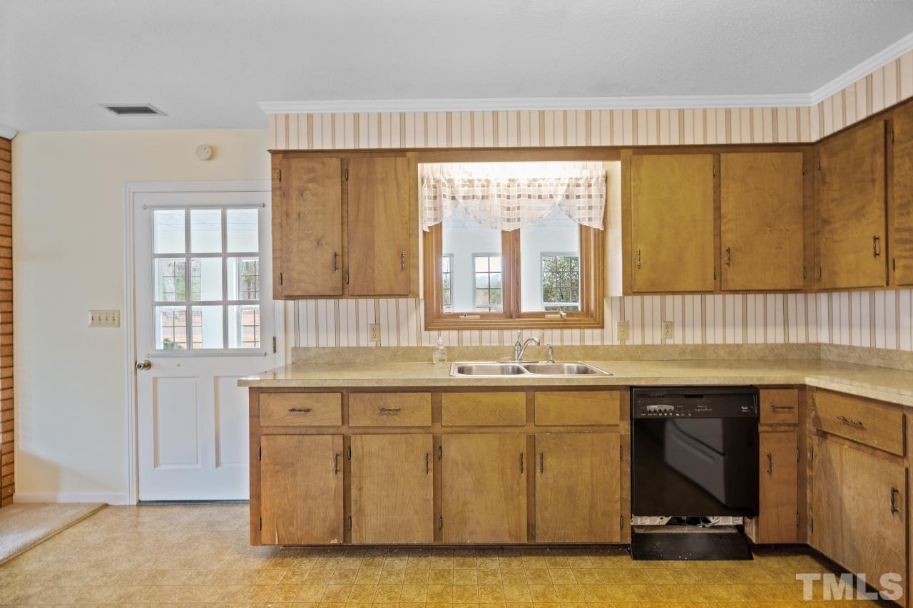 4762 Farrell Road Sanford, NC 27330 - Photo 10 of 18 a kitchen with a sink and cabinets