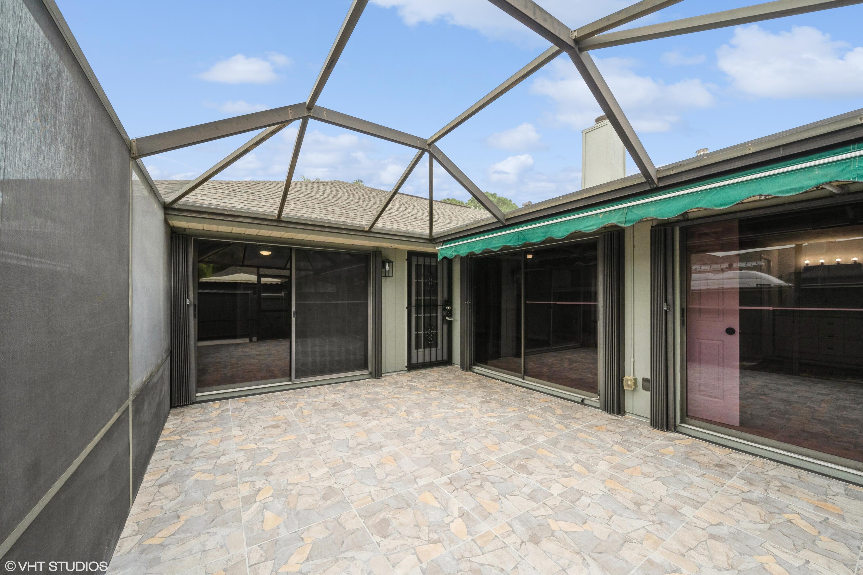 735 Timber Ridge Trail Southwest, Unit A Vero Beach, FL 32962 - Photo 1 of 15 FRONT PATIO ENTRANCE