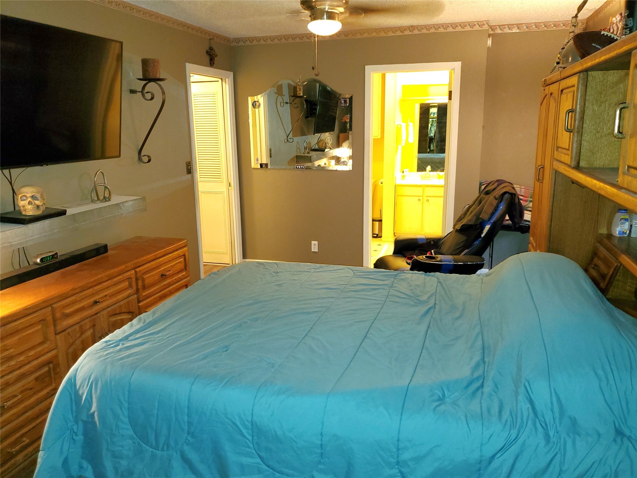 6622 Spring Haven Street San Antonio, TX 78249 - Photo 18 of 25 a bedroom with a bed flat screen tv and a large window