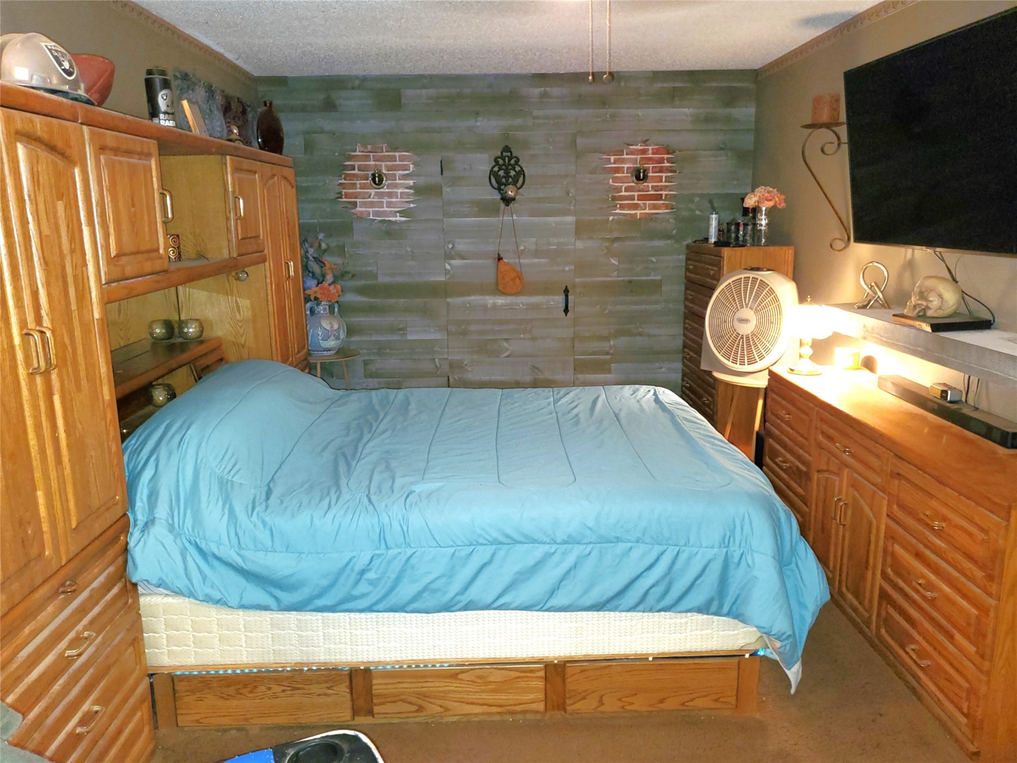 6622 Spring Haven Street San Antonio, TX 78249 - Photo 19 of 25 a bedroom with a bed and a flat tv screen on dresser