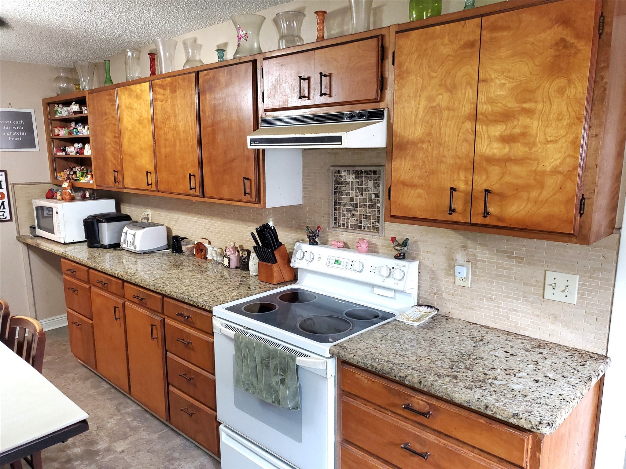 6622 Spring Haven Street San Antonio, TX 78249 - Photo 4 of 25 a kitchen with stainless steel appliances granite countertop a sink stove and cabinets