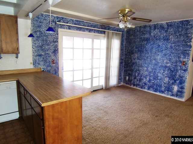 3375 Canvasback Lane Reno, NV 89508 - Photo 3 of 9 a view of a livingroom with a ceiling fan and window