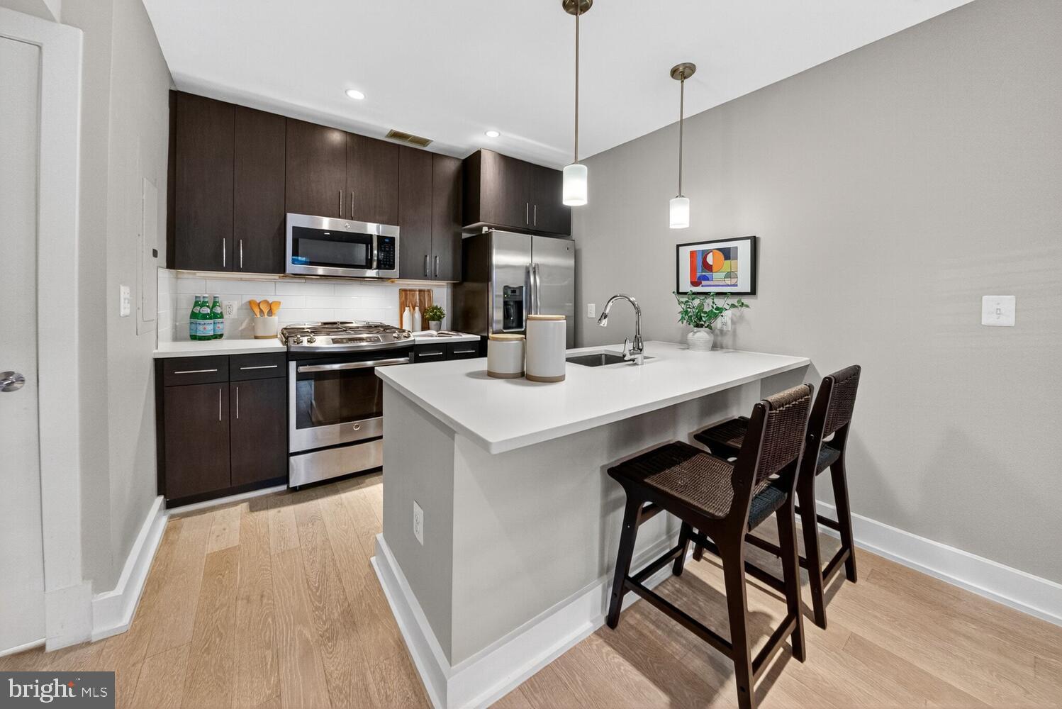 2724 12th Street Northeast, Unit 9 Washington, DC 20018 - Photo 5 of 17 Modern Open Kitchen w/ Stainless Steel Appliances