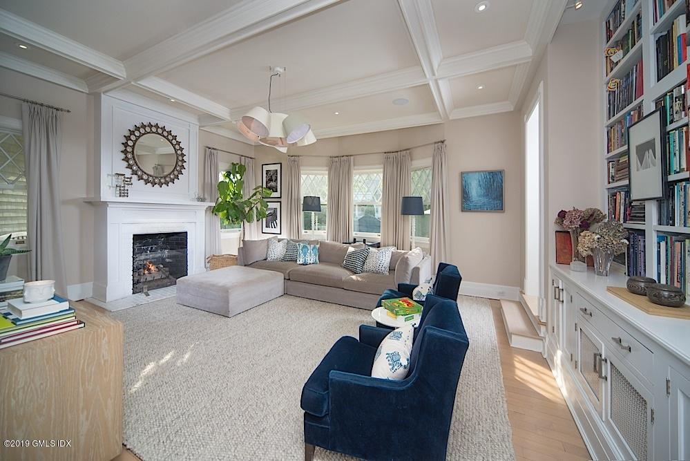 2 Keofferam Road Old Greenwich, CT 06870 - Photo 12 of 27 a living room with furniture and a fireplace