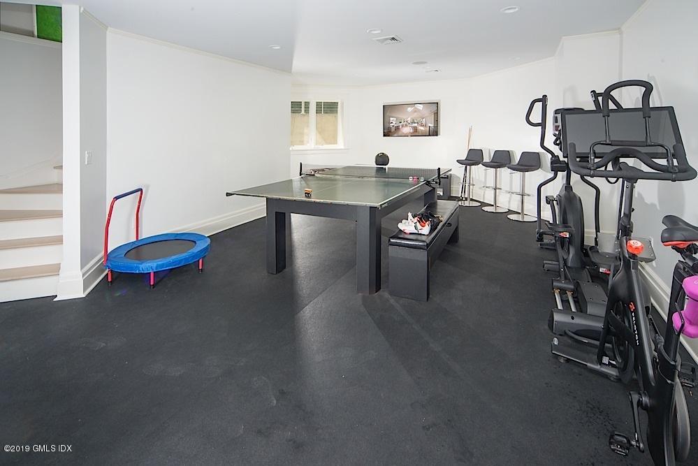 2 Keofferam Road Old Greenwich, CT 06870 - Photo 14 of 27 a dining room with furniture and a flat screen tv