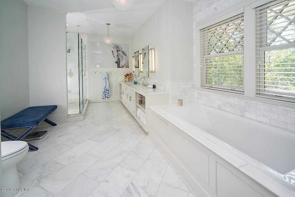 2 Keofferam Road Old Greenwich, CT 06870 - Photo 16 of 27 a spacious bathroom with a tub sink and toilet