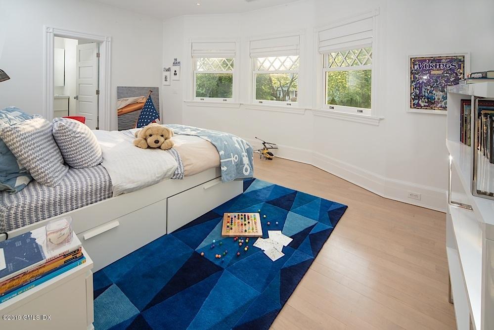 2 Keofferam Road Old Greenwich, CT 06870 - Photo 18 of 27 a bedroom with a bed and window