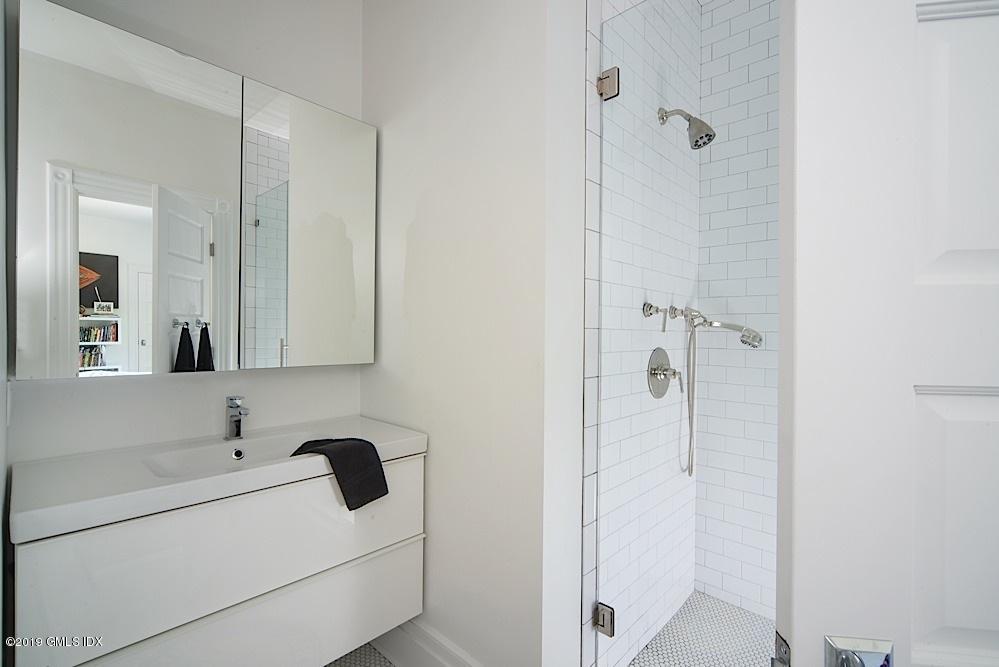 2 Keofferam Road Old Greenwich, CT 06870 - Photo 19 of 27 a bathroom with a sink and mirror