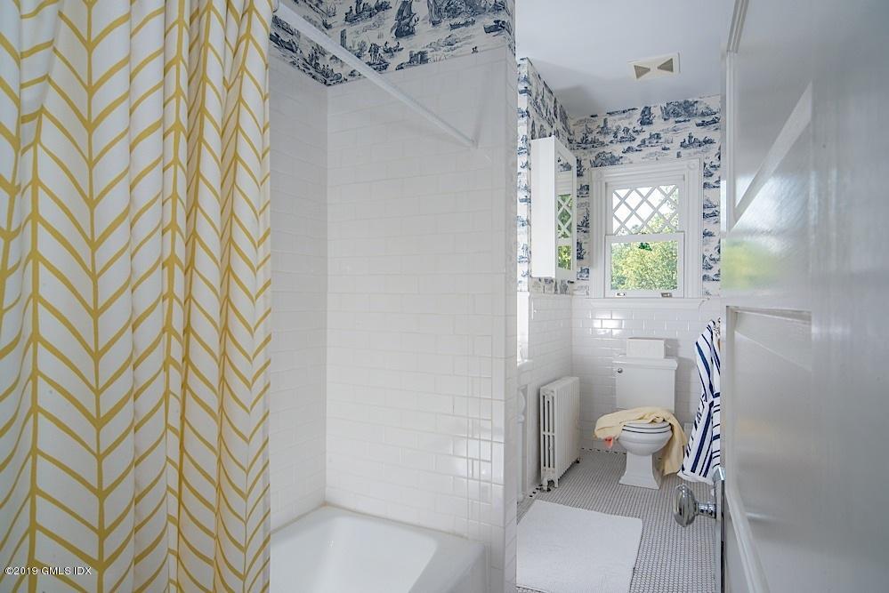 2 Keofferam Road Old Greenwich, CT 06870 - Photo 22 of 27 a bathroom with a sink toilet and shower
