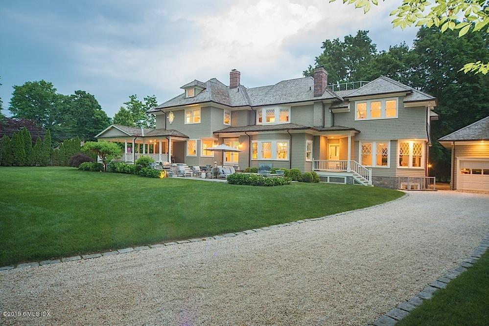 2 Keofferam Road Old Greenwich, CT 06870 - Photo 25 of 27 a front view of a house with a yard and potted plants