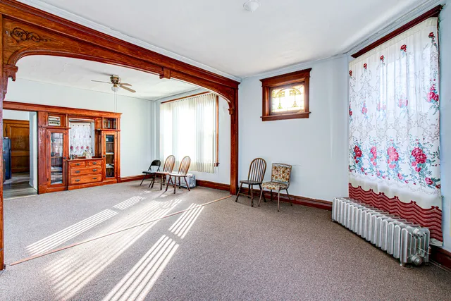 a bedroom with furniture and a window