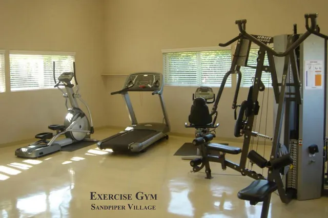 a view of a room with shelves and wooden floor