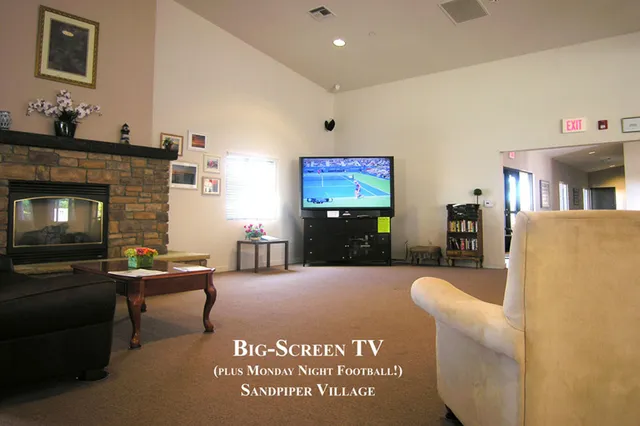 a view of a dining area with furniture and a table