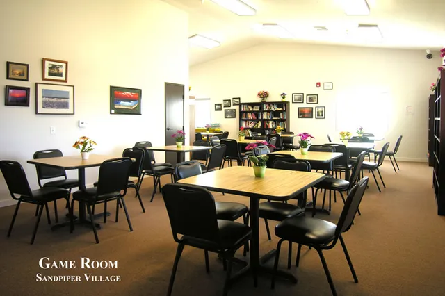 a dining table with chairs and window