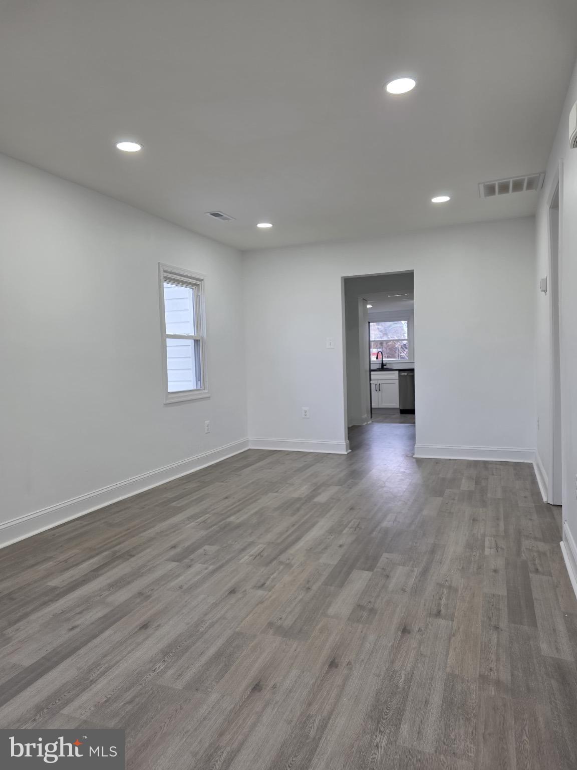 580 York Avenue Winchester, VA 22601 - Photo 3 of 12 an empty room with wooden floor and windows