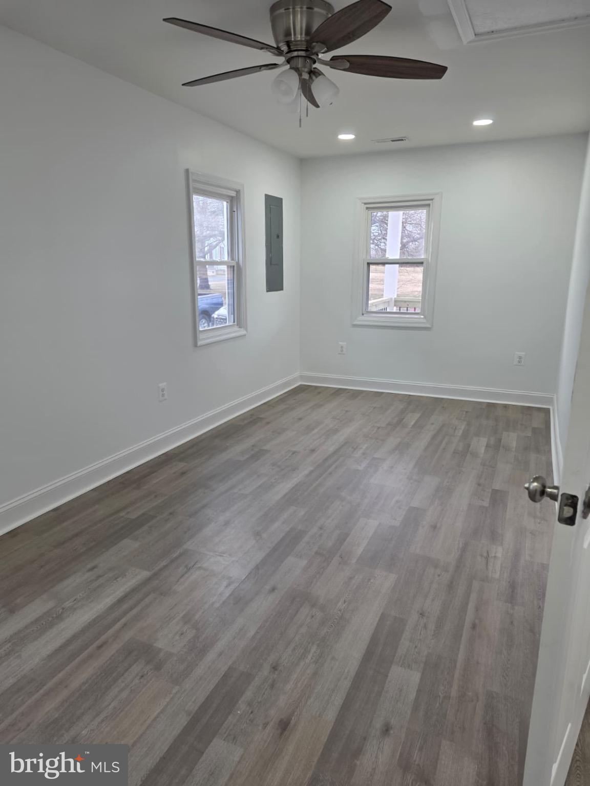 580 York Avenue Winchester, VA 22601 - Photo 4 of 12 a view of an empty room with a window and wooden floor