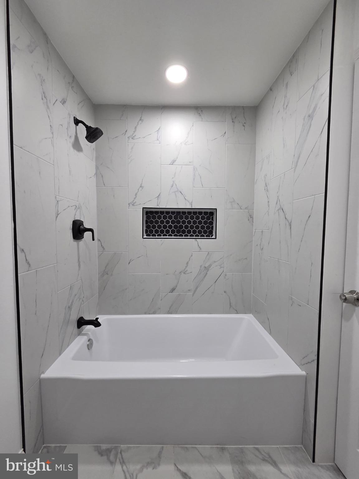 580 York Avenue Winchester, VA 22601 - Photo 7 of 12 a bathroom with a tub and a shower