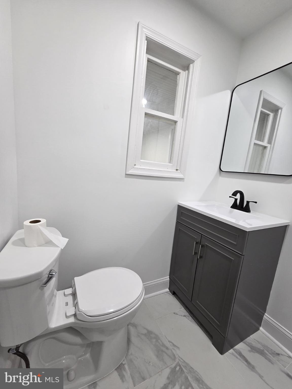 580 York Avenue Winchester, VA 22601 - Photo 8 of 12 a bathroom with a toilet sink and mirror