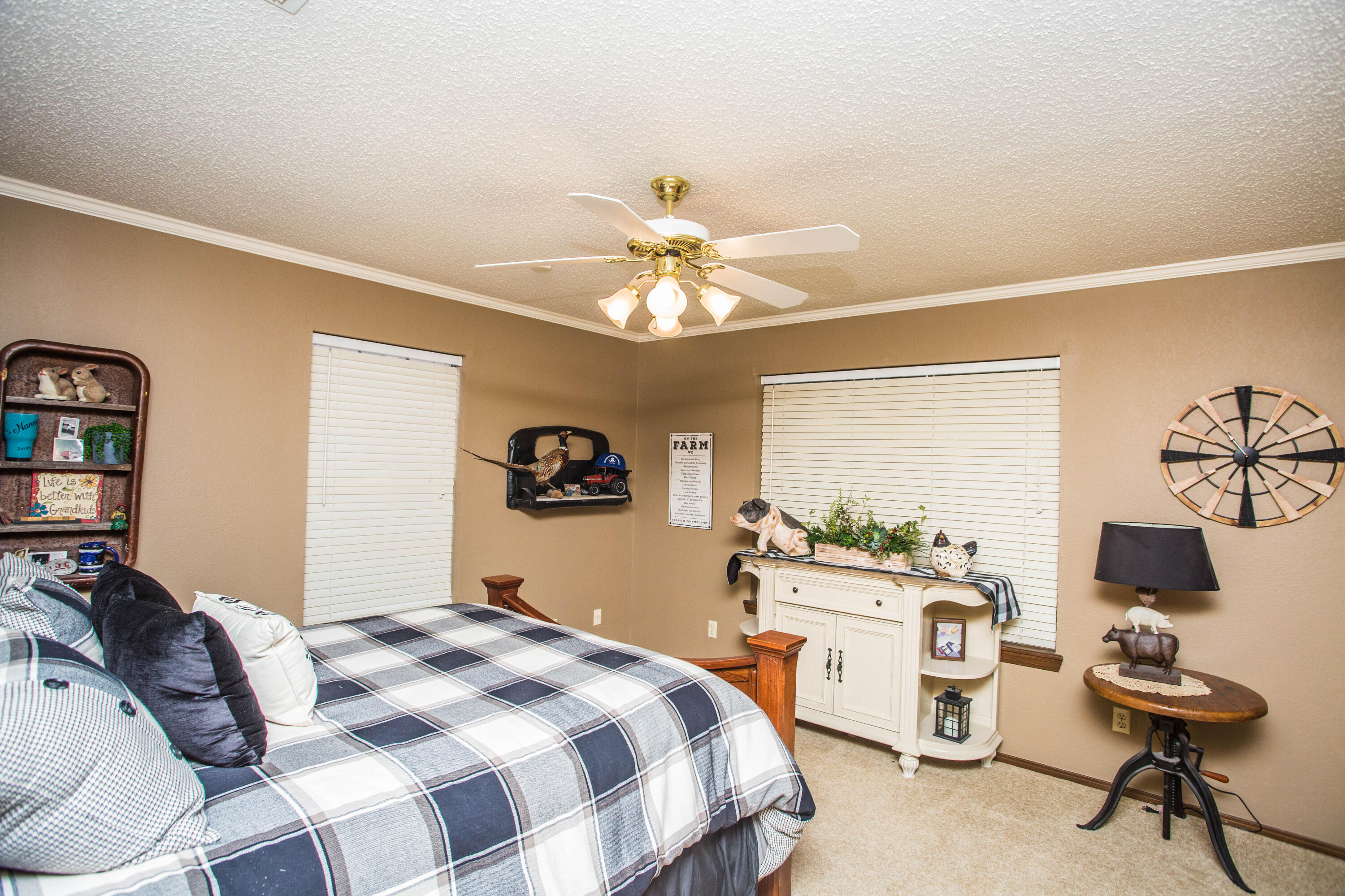 1304 Jefferson Drive Plainview, TX 79072 - Photo 35 of 50 a bedroom with a bed and a chandelier