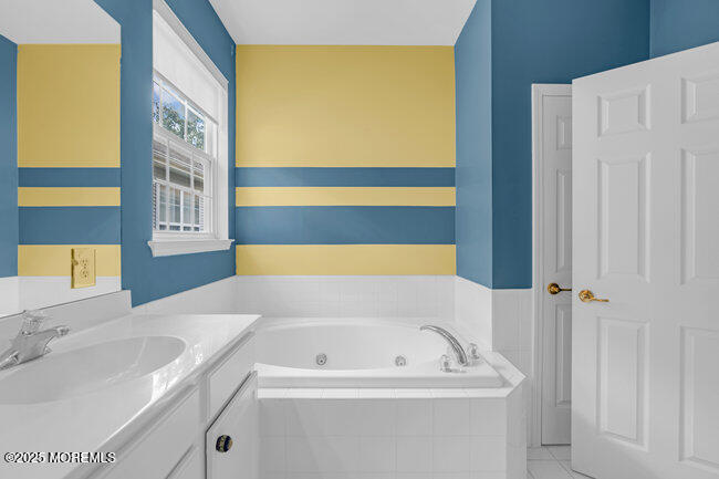 5 Banstead Way Jackson, NJ 08527 - Photo 30 of 59 a bathroom with a sink and a bathtub