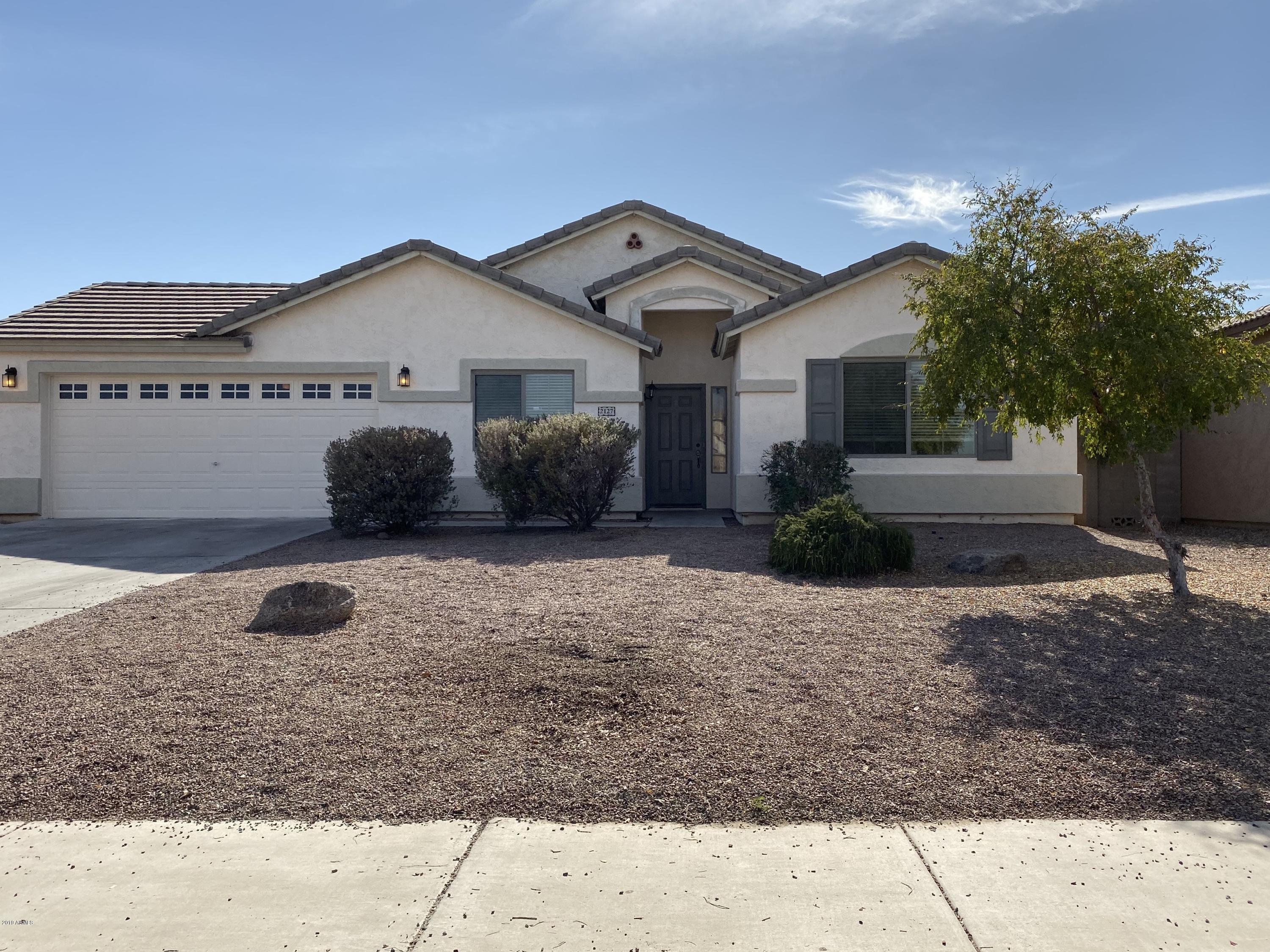 2127 West Vineyard Road Phoenix, AZ 85041 - Photo 1 of 8 a front view of a house with garage