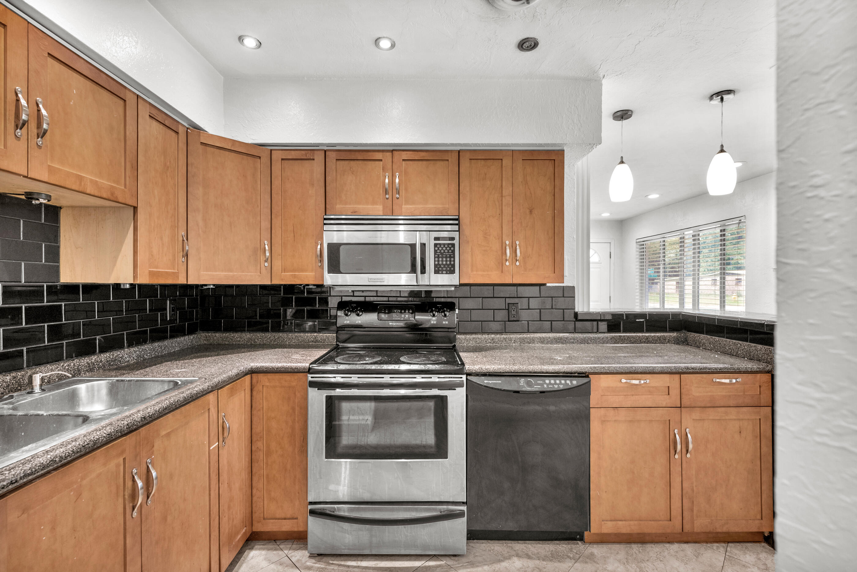 600 Shrewsbury Road Mary Esther, FL 32569 - Photo 11 of 25 a kitchen with stainless steel appliances granite countertop a sink stove and cabinets