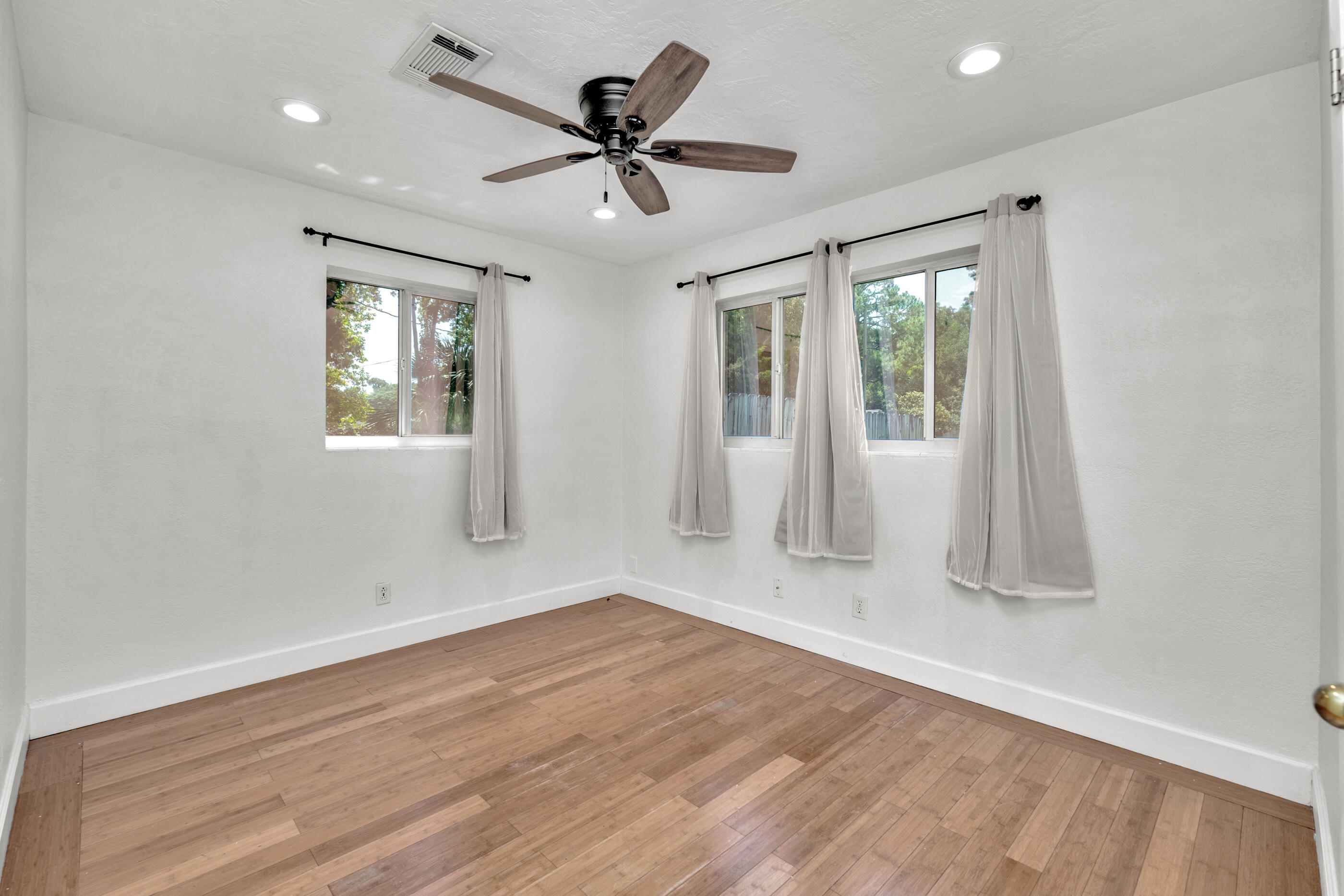 600 Shrewsbury Road Mary Esther, FL 32569 - Photo 15 of 25 a view of empty room with wooden floor and fan