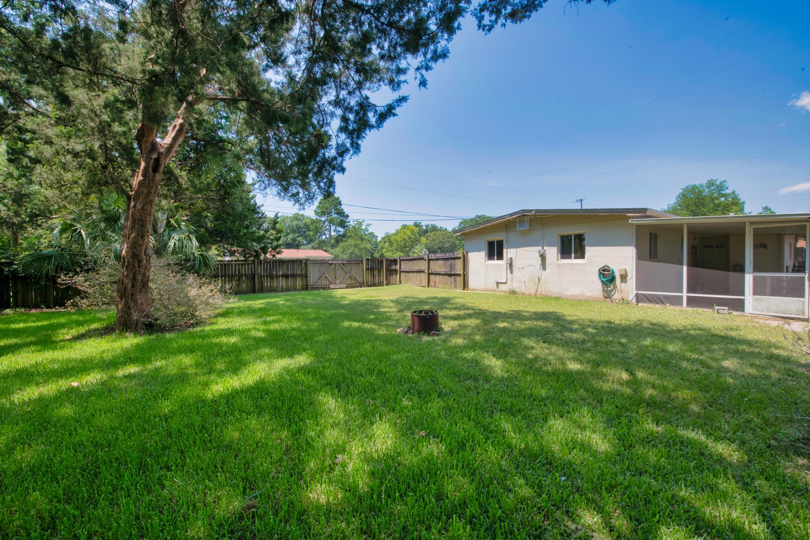 600 Shrewsbury Road Mary Esther, FL 32569 - Photo 24 of 25 a view of a house with backyard and a tree