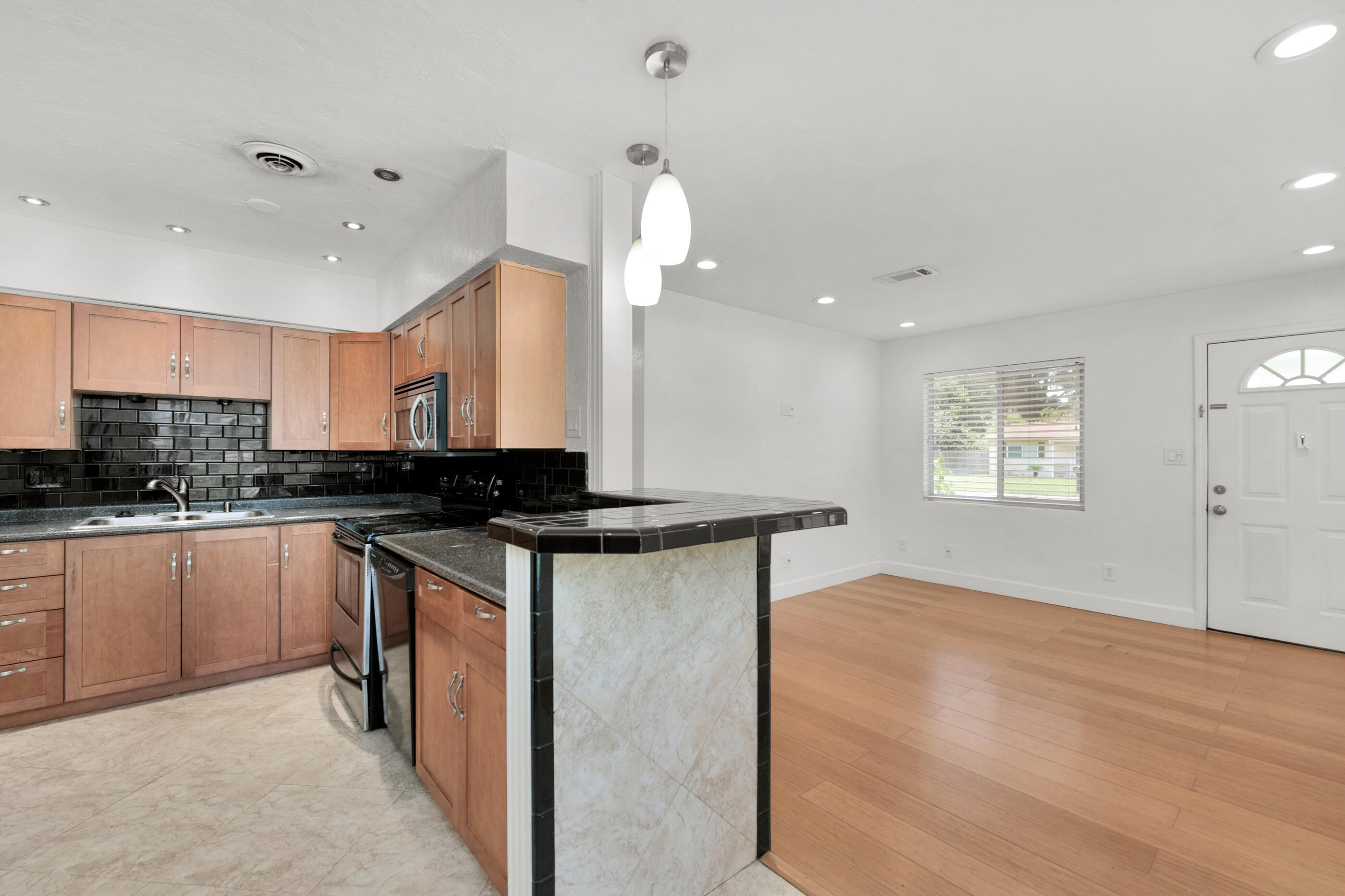 600 Shrewsbury Road Mary Esther, FL 32569 - Photo 8 of 25 a kitchen with a sink cabinets and wooden floor