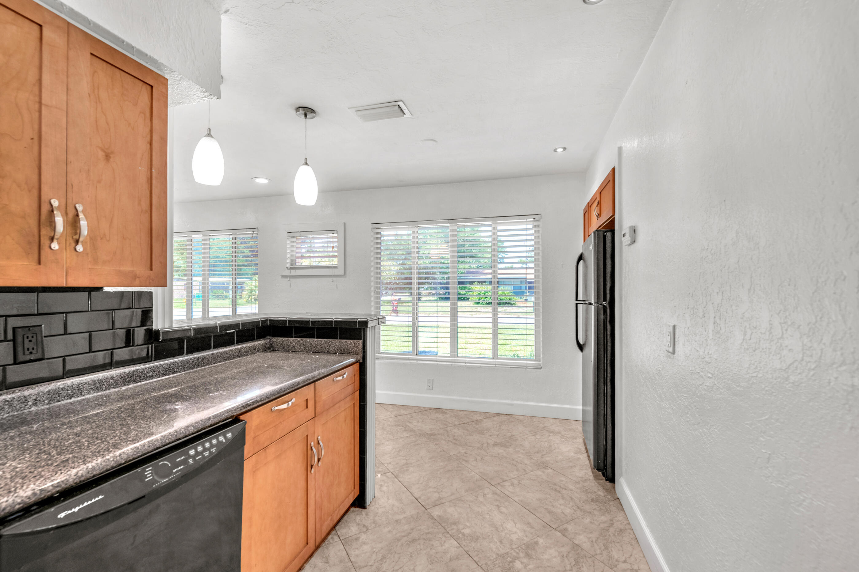 600 Shrewsbury Road Mary Esther, FL 32569 - Photo 10 of 25 a kitchen with granite countertop a sink and a stove