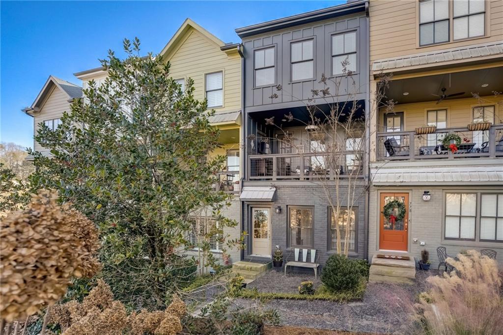 a front view of a building with garden