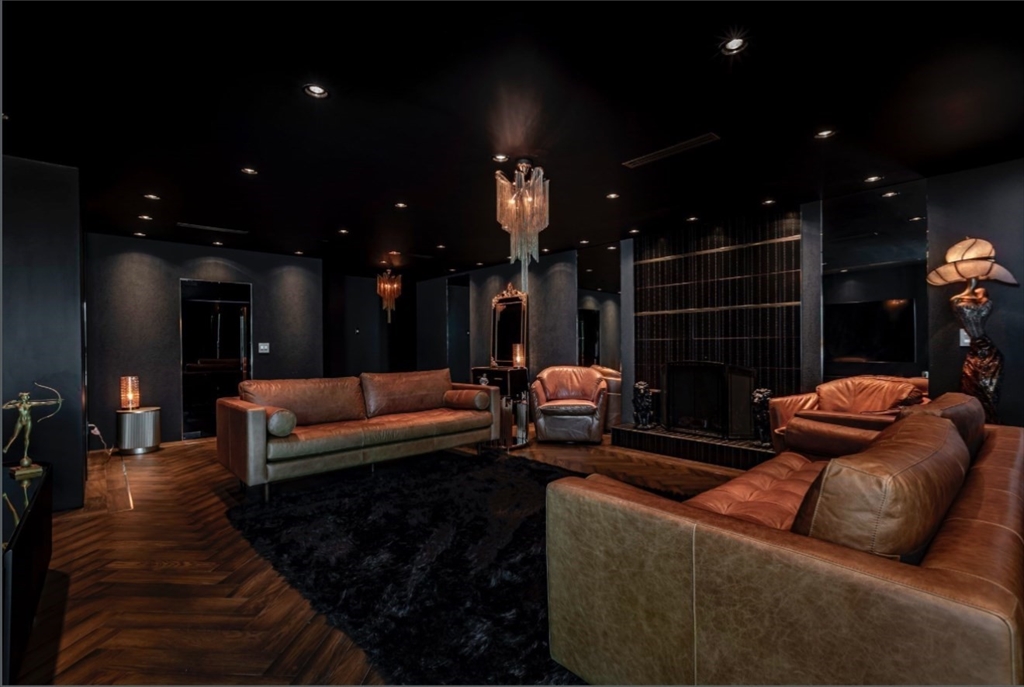 a living room with furniture and a lamp