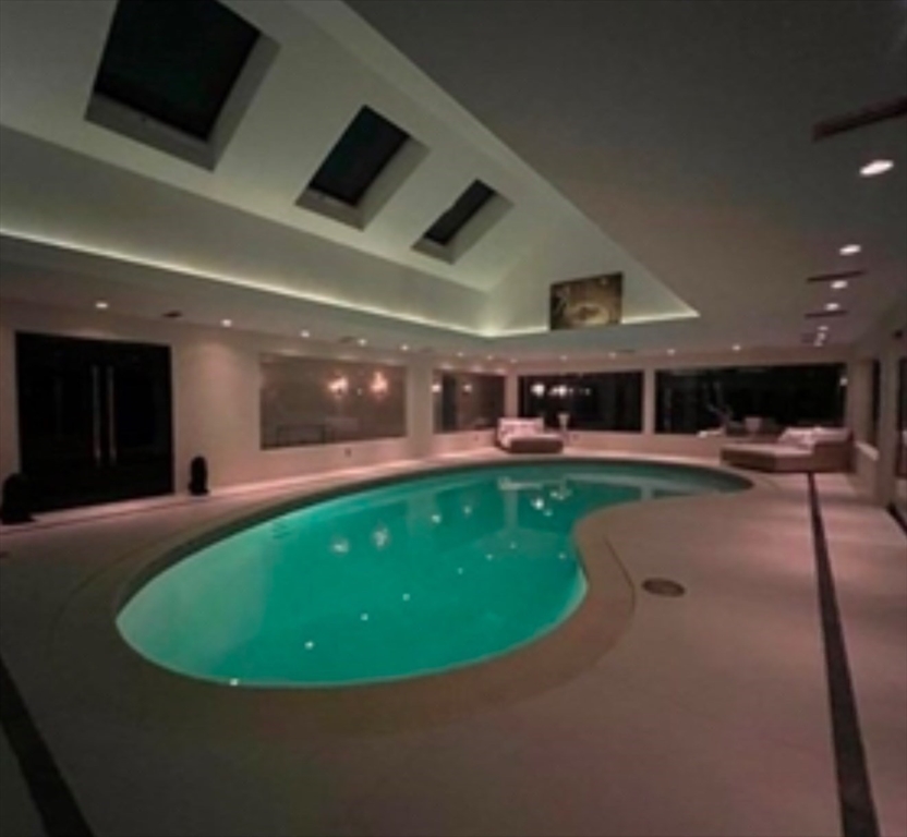 15 Scotch Dam Road Easton, MA 02375 - Photo 13 of 29 a view of a swimming pool with seating space