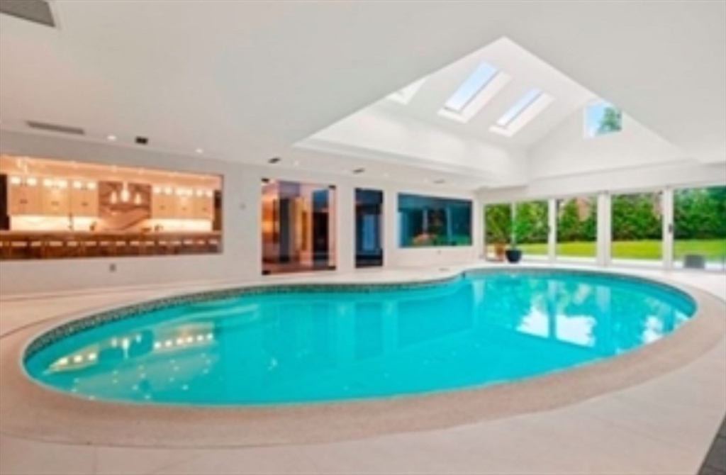 15 Scotch Dam Road Easton, MA 02375 - Photo 16 of 29 a view of a swimming pool with lawn chairs and potted plants