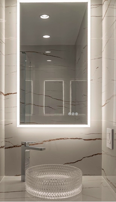 15 Scotch Dam Road Easton, MA 02375 - Photo 21 of 29 a bathroom with a bathtub and window