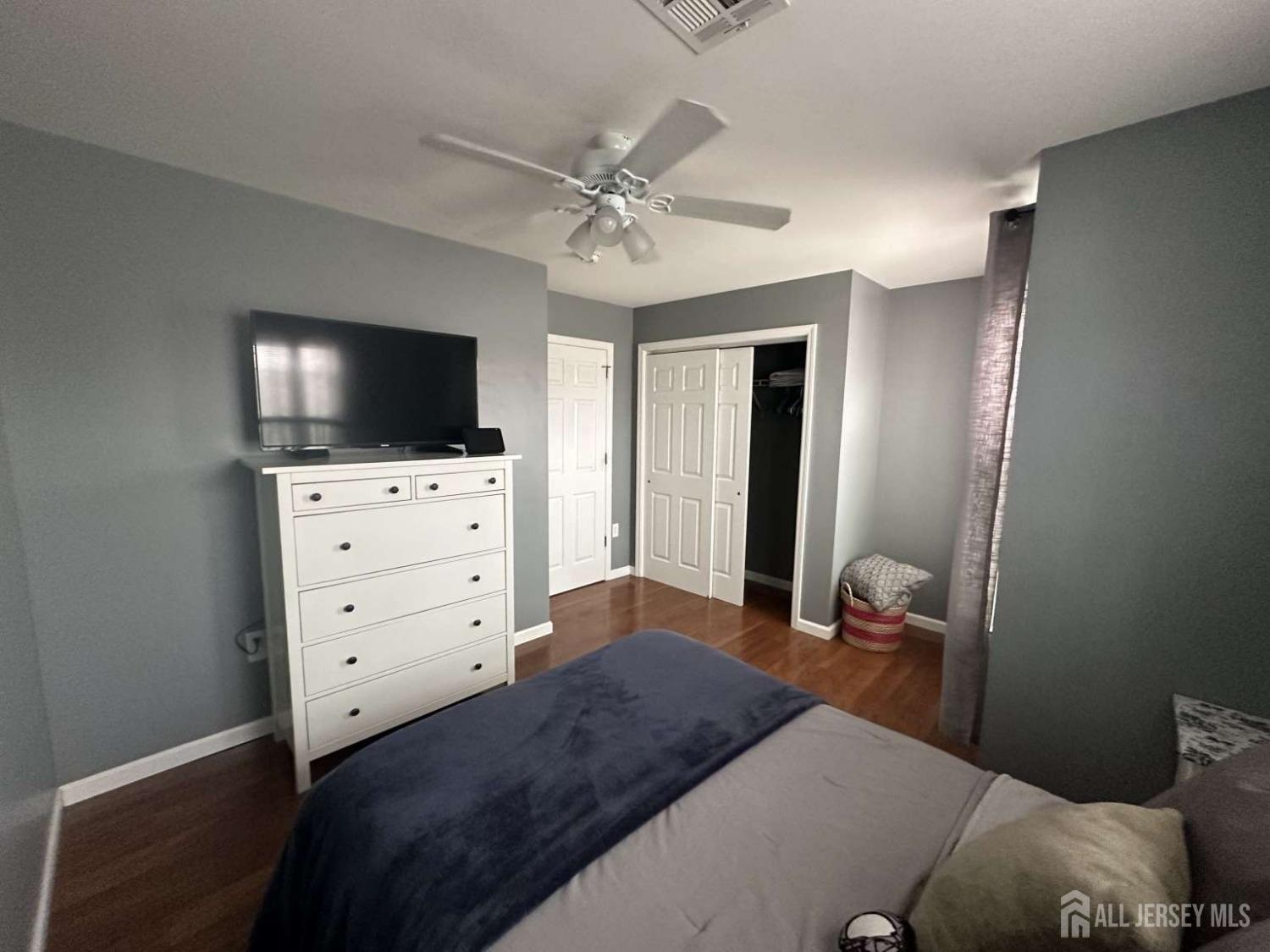 207 Remsen Avenue Avenel, NJ 07001 - Photo 17 of 24 a bedroom with a bed and a flat screen tv